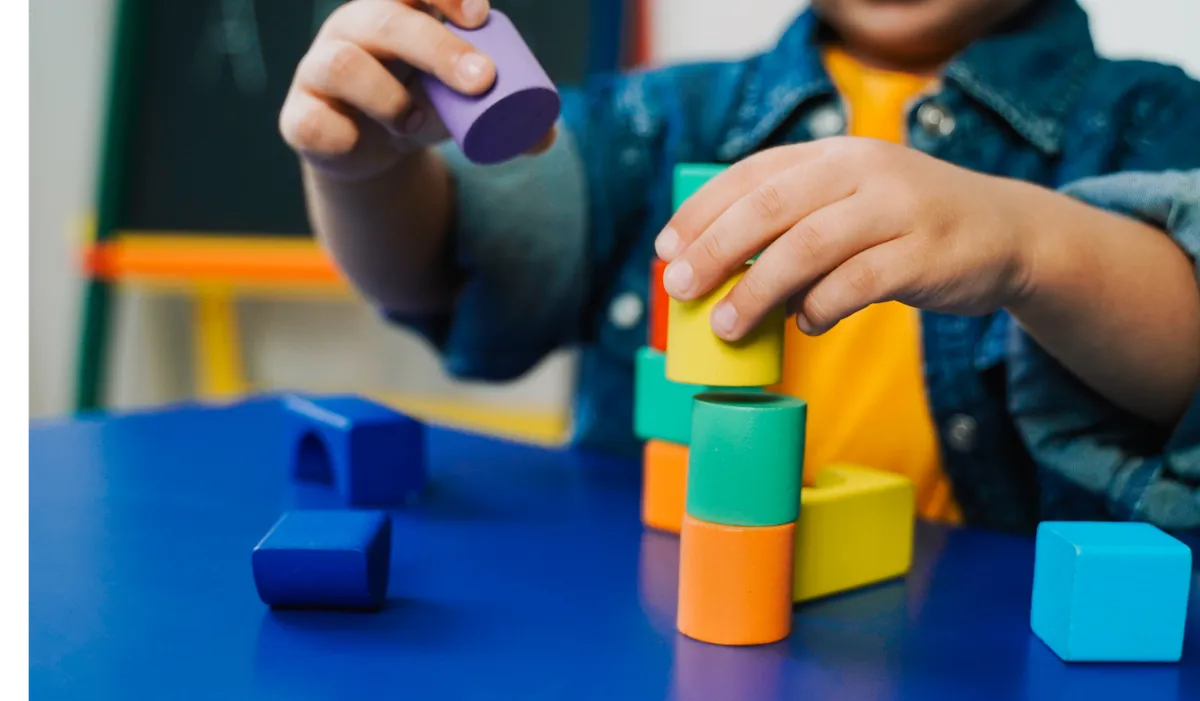 Children playing with colourful building blocks at a nursery